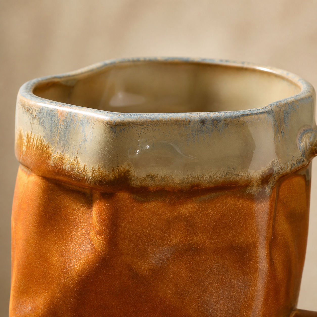 Ember Glow faceted reactive glaze mug, glaze texture close-up